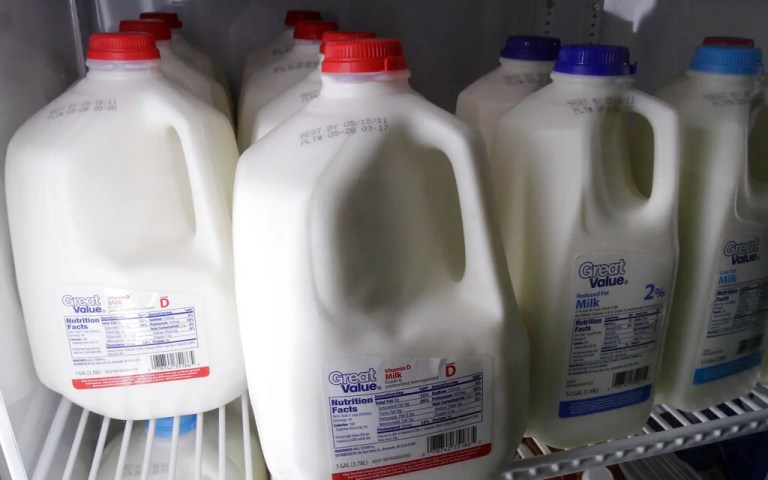 ontainers of milk sit in a dairy case at a Little Rock, Ark., food warehouse
