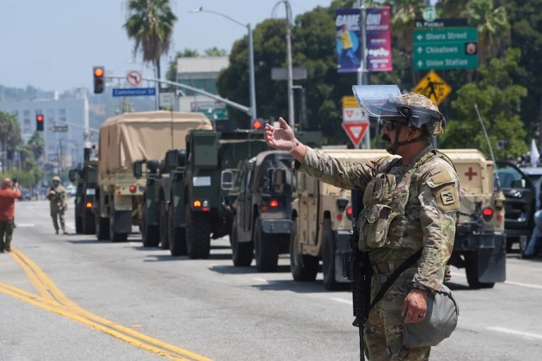 U.S. National Guard direct Tuesday, June 10, 2025, in Los Angeles. (AP Photo Damian Dovarganes)