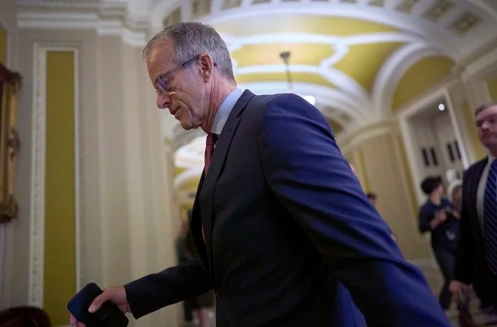 Senate Majority Leader John Thune (R-SD) arrives at the chamber as Republican senators meet to find a way to help President Donald Trump cancel $9.4 billion in spending already approved by Congress, at the Capitol in Washington, Wednesday, June 11, 2025.