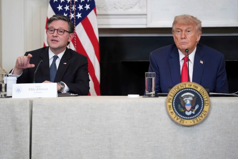 House Speaker Mike Johnson, R-La., speaks as President Donald Trump listens during an 