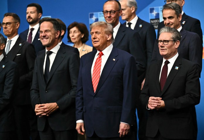 NATO Secretary General Mark Rutte, from left, President Donald Trump and Britain's Prime Minister Keir Starmer pose with NATO country leaders for a family photo during the NATO summit in The Hague, Netherlands, Wednesday, June 25, 2025.