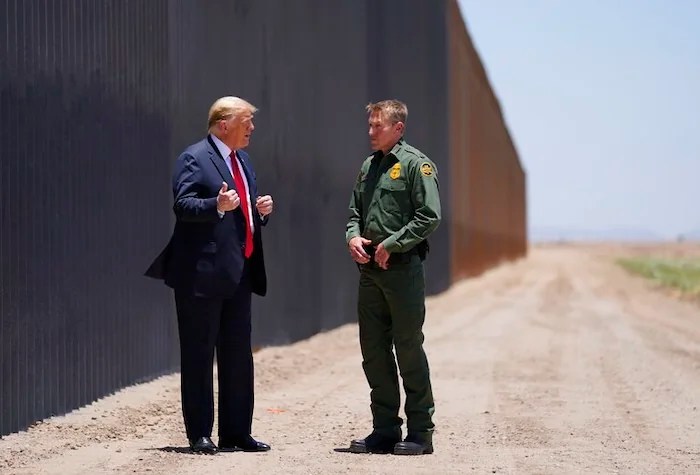 United State Border Patrol chief Rodney Scott gives President Donald Trump a tour of a section of the border wall, Tuesday, June 23, 2020, in San Luis, Ariz. (AP Photo/Evan Vucci)