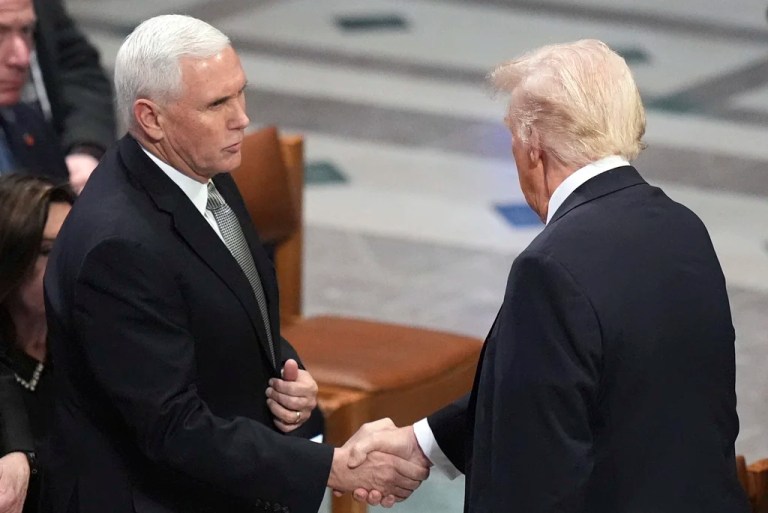 President Donald Trump, right, shakes hands with former Vice President Mike Pence before the state funeral for President Jimmy Carter at Washington National Cathedral in Washington, Jan. 9, 2025.