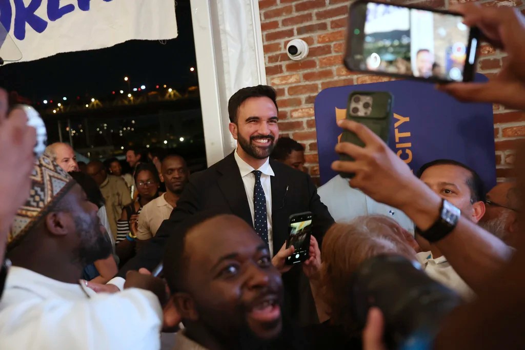 Democratic mayoral candidate Zohran Mamdani takes selfies with supporters after speaking at his primary election party, Wednesday, June 25, 2025, in New York.