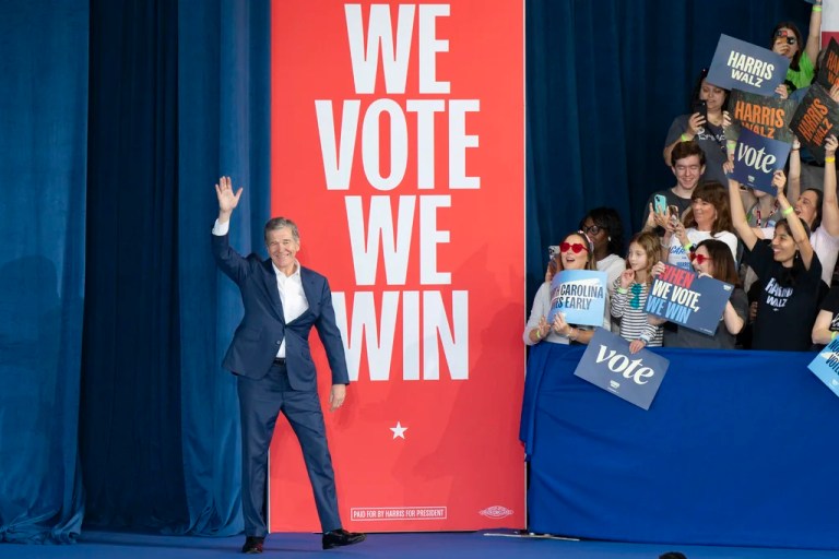 Gov. Roy Cooper (D-NC) arrives onstage before Democratic presidential nominee Vice President Kamala Harris arrives to speak at a campaign rally, Wednesday, Oct. 30, 2024, in Raleigh.