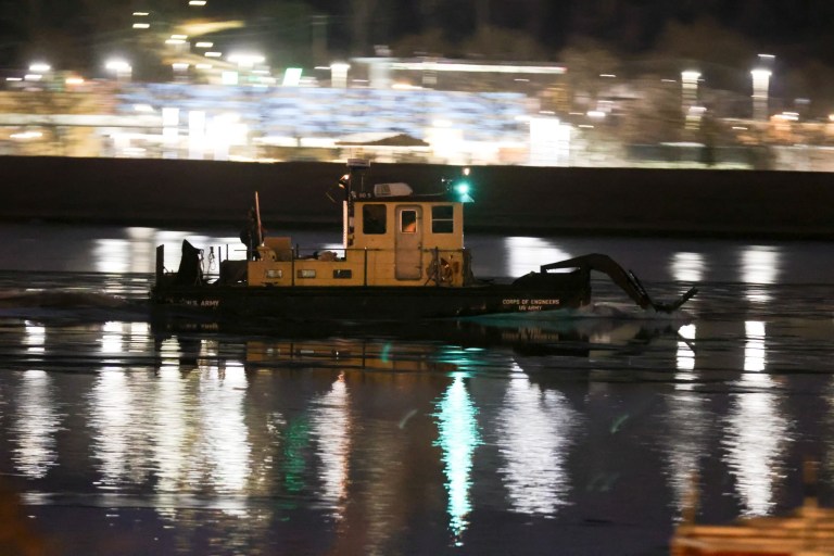 A U.S. Army Corps of Engineers boat breaks through ice on the Potomac River in Washington, D.C. on January 29, 2025 in order to facilitate rescue efforts following the collision of a commercial aircraft and a helicopter over the Potomac River near Ronald Reagan National Airport.