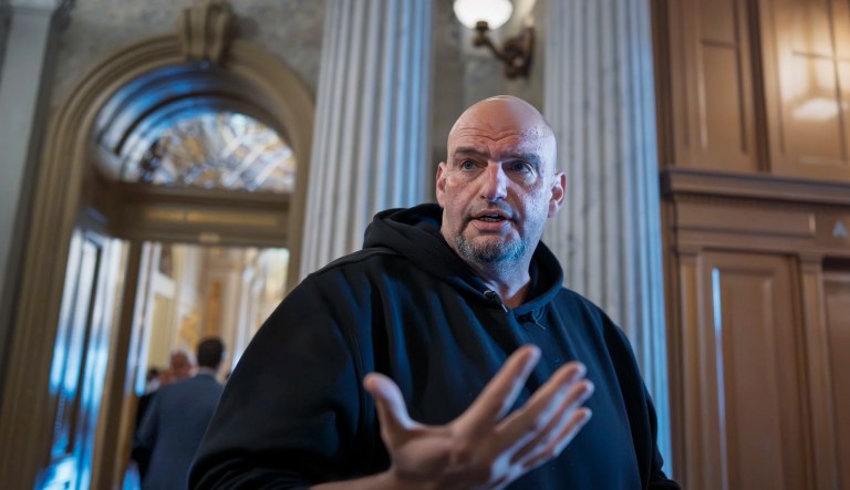 FILE - Sen. John Fetterman, D-Pa., talks to reporters outside the chamber during a vote at the Capitol in Washington, March 13, 2025.