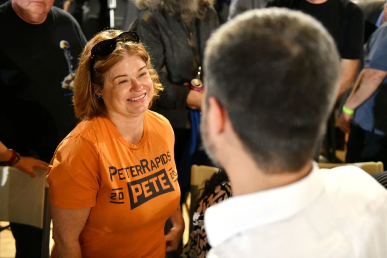 Brenda Masters of Cedar Rapids, Iowa, greets former Secretary of Transportation Pete Buttigieg, wearing a T-shirt she made while volunteering for Buttigieg during the 2020 Iowa Caucus, during a VoteVets Town Hall, Tuesday, May 13, 2025, in Cedar Rapids, Iowa.
