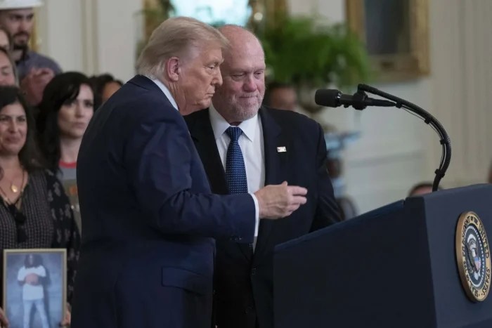 President Donald Trump talks with White House border czar Tom Homan at an event to promote Trump's domestic policy and budget agenda in the East Room of the White House, Thursday, June 26, 2025, in Washington. ( (AP Photo/Jose Luis Magana)