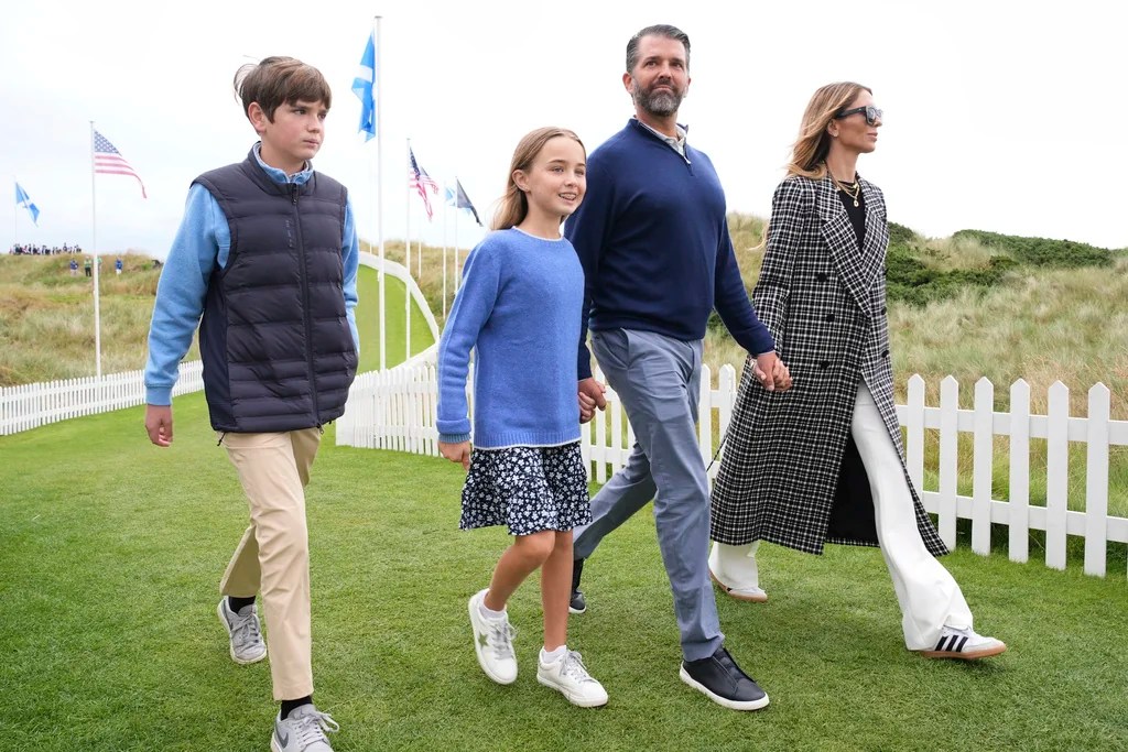 Donald Trump Jr. and Betina Anderson arrice with children Tristan and Chloe at the opening ceremony for the Trump International Golf Links golf course, near Aberdeen, Scotland, Tuesday, July 29, 2025.