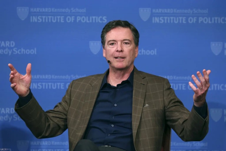 Former FBI director James Comey gestures while speaking at Harvard University's Institute of Politics' JFK Jr. Forum in Cambridge, Mass., Feb. 24, 2020.