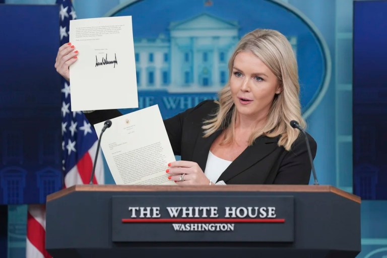 White House press secretary Karoline Leavitt holds up a tariff-related letter signed by President Donald Trump.