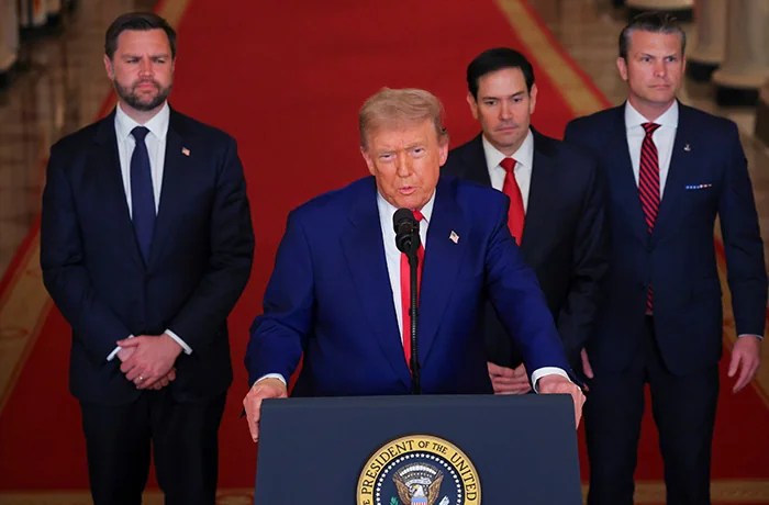 Trump speaks from the East Room of the White House on June 21 after the U.S. military struck three Iranian nuclear and military sites, directly joining Israel’s effort to decapitate the country’s nuclear program, as Vice President JD Vance, Secretary of State Marco Rubio, and Defense Secretary Pete Hegseth listen. (Carlos Barria/Pool via AP)