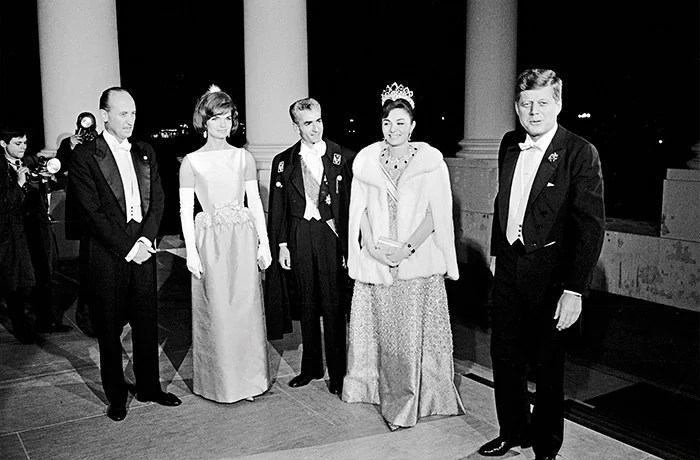 First Lady Jacqueline Kennedy, left, and President John F. Kennedy, right, welcome Shah of Iran Mohammad Reza Pahlavi and his wife Farah Pahlavi to the White House in Washington, D.C., April 11, 1962. (Universal History Archive / Universal Images Group / Getty Images)