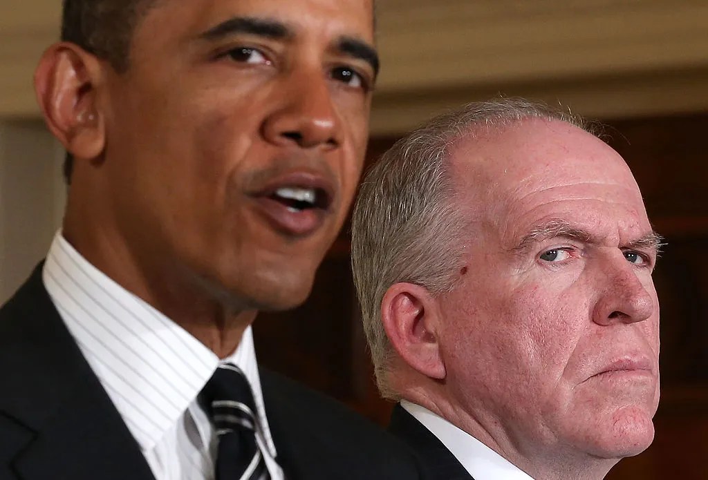President Barack Obama (L) speaks as Deputy National Security Advisor for Homeland Security and Counterterrorism John Brennan (R) listens while making personnel announcements during an event in the East Room at the White House, on January 7, 2013 in Washington, DC. President Obama has nominated Brennan to become the new director of the CIA. (Photo by Alex Wong/Getty Images)