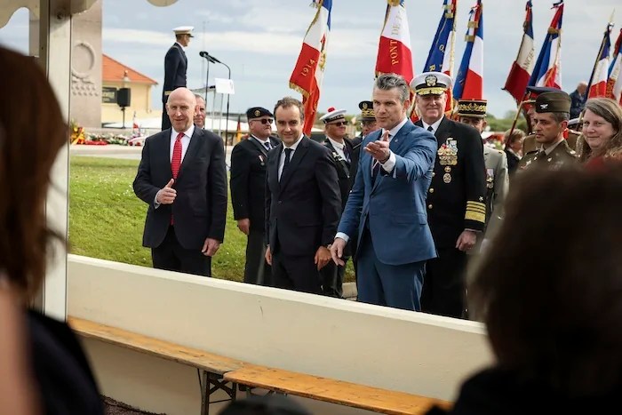 U.S.Defense Secretary Pete Hegseth, center right, French Defense Minister Sébastien Lecornu, center, and U.K. Defense Secretary John Healey attend the international ceremony commemorating the 81st anniversary of the D-Day landings, Friday, June 6, 2025 on Utah Beach, Normandy.
