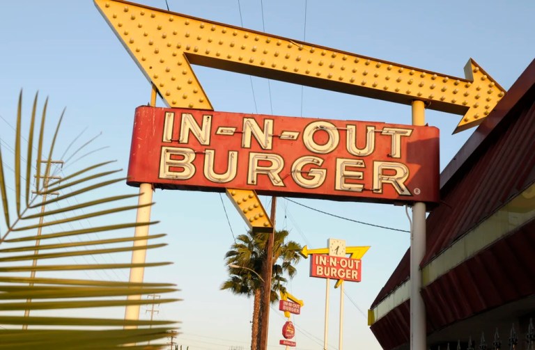 In-N-Out Burger signs fill the skyline on Tuesday, June 8, 2010, in Calif. In-N-Out is barring employees in five states from wearing masks unless they have a doctor’s note, according to internal company emails leaked on social media last week.
