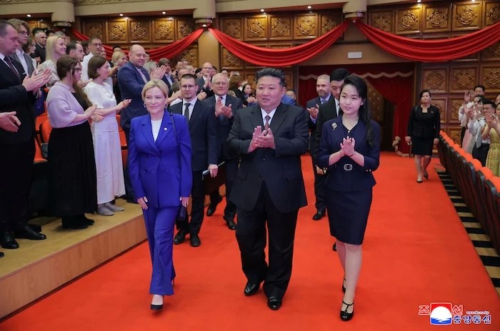In this photo provided by the North Korean government, North Korean leader Kim Jong Un, center, his daughter, Kim Ju Ae, right, and Russian Minister of the Culture Olga Lyubimova, left, arrive at the East Pyongyang Grand Theatre in Pyongyang, North Korea Sunday, June 29, 2025. Independent journalists were not given access to cover the event depicted in this image distributed by the North Korean government. The content of this image is as provided and cannot be independently verified. Korean language watermark on image as provided by source reads: 