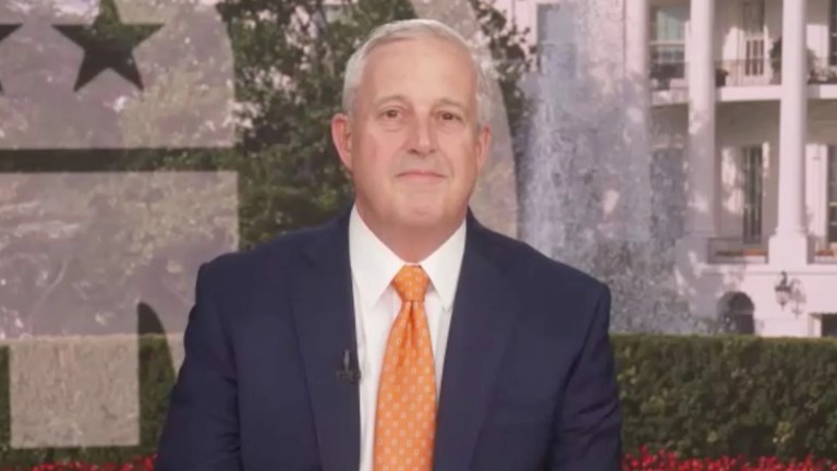 Man smiling in a suit