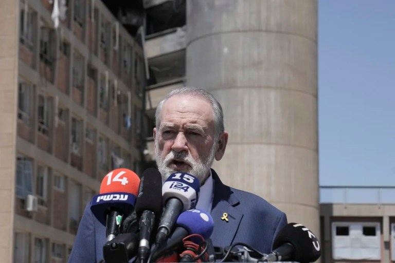 U.S. Ambassador to Israel Mike Huckabee speaks to journalists outside a building at Soroka Medical Center in Beersheba, Israel, which was struck by an Iranian missile, Thursday, June 26, 2025.
