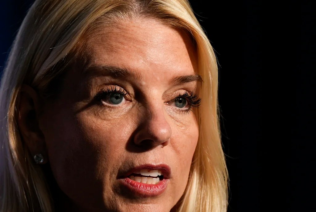 Attorney General Pam Bondi points to a graphic while speaking at a news conference at the Drug Enforcement Administration, Tuesday, July 15, 2025, in Arlington, Va.