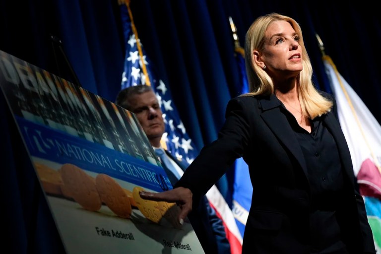 Attorney General Pam Bondi points to a graphic while speaking at a news conference at the Drug Enforcement Administration, Tuesday, July 15, 2025, in Arlington, Va.