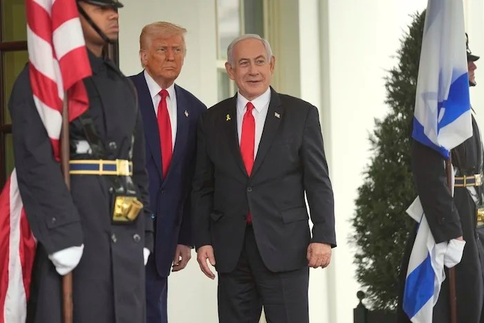 President Donald Trump, left, greets Israeli Prime Minister Benjamin Netanyahu at the White House, Monday, April 7, 2025, in Washington.