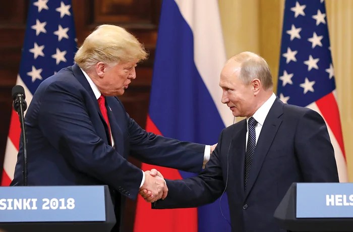 President Donald Trump shakes hands with Russian President Vladimir Putin in Helsinki, Finland, on July 16, 2018. (Chris Ratcliffe/Bloomberg via Getty Images)