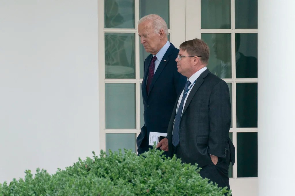 President Joe Biden walks along the Colonnade at the White House with his physician Kevin O'Connor, Aug. 28, 2023. O'Connor, known to President Joe Biden and others around the White House simply as "doc", has been a part of the president's life for more than a decade and was a central figure to the family when Biden's son Beau was dying of cancer. 