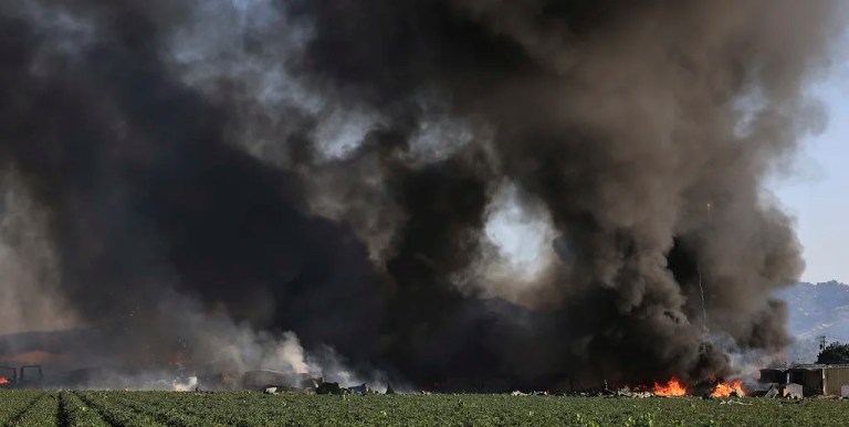 Smoke and flames rise during a fireworks warehouse explosion near Esparto, Calif., Tuesday, July 1, 2025.