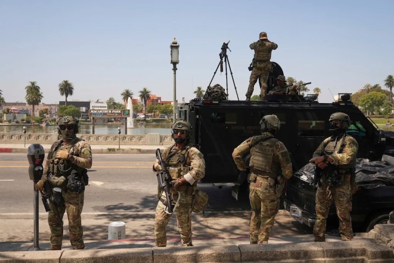 Federal agents stage at MacArthur Park Monday, July 7, 2025, in Los Angeles.
