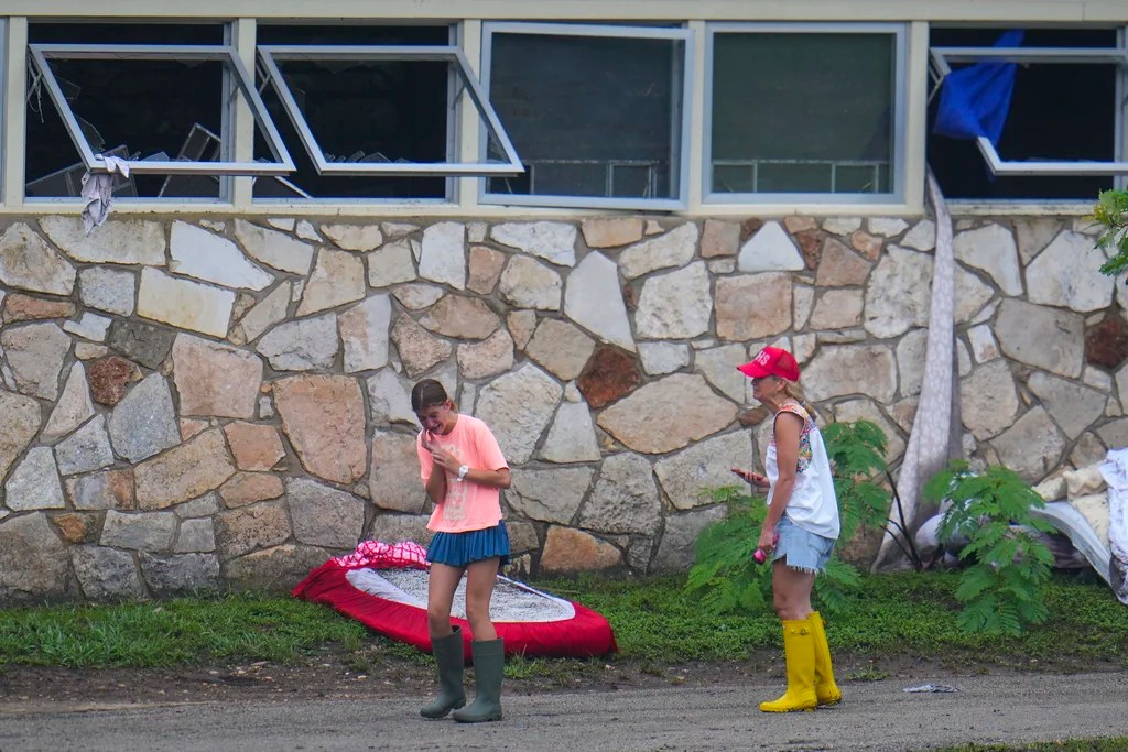 People react as they inspect an area outside sleeping quarters at Camp Mystic along the banks of the Guadalupe River after a flash flood swept through the area Sunday, July 6, 2025, in Hunt, Texas.