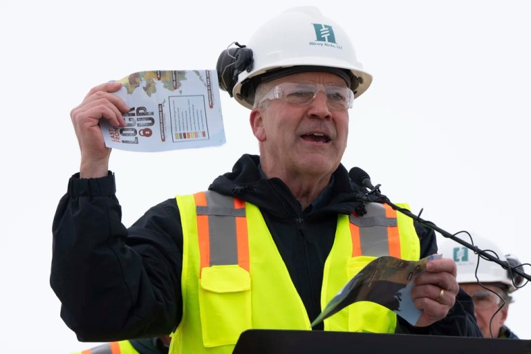 Sen. Dan Sullivan, R-Alaska, rips up a piece of paper that had plans from the Biden administration during news conference at the Pump Station 1 on Monday, June 2, 2025, located near Deadhorse, Alaska, on the state's prodigious North Slope. (AP Photo/Jenny Kane)