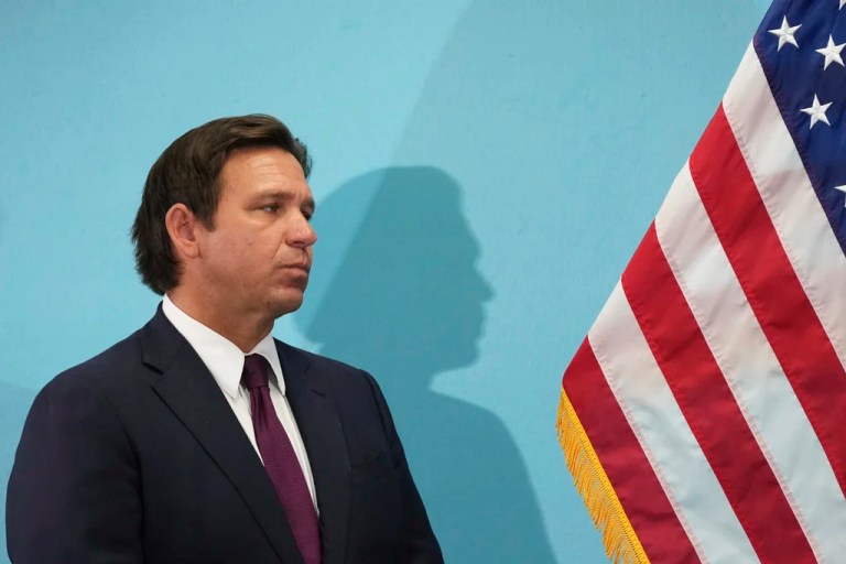 Florida Gov. Ron DeSantis listens during a public event where he announced he would sign a bill banning the use of fluoride in public water systems, Tuesday, May 6, 2025, in Miami.