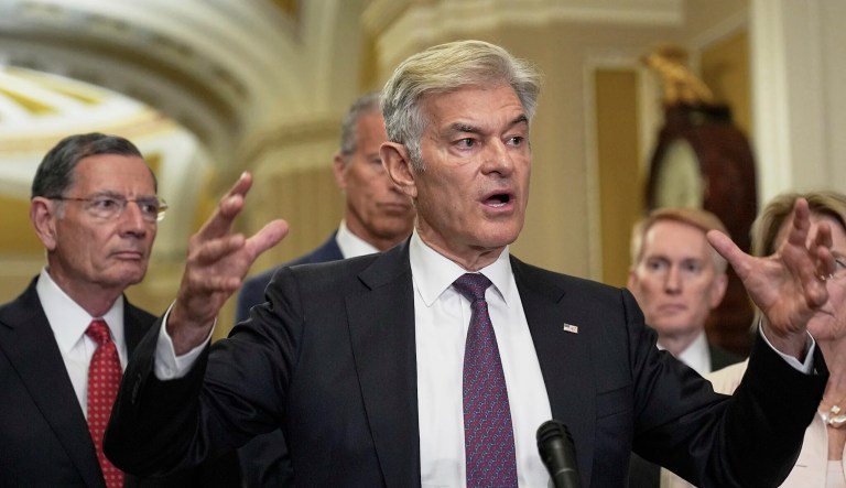 Center for Medicare and Medicaid Services Administrator Dr. Mehmet Oz, center, talks after a policy luncheon on Capitol Hill, Tuesday, June. 17, 2025, in Washington.