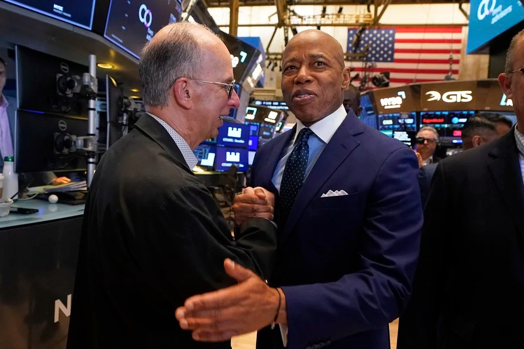 Trader Joe Dente, left, meets New York Mayor Eric Adams on the floor of the New York Stock Exchange after Adams was interviewed on CNBC, Friday, June 27, 2025.