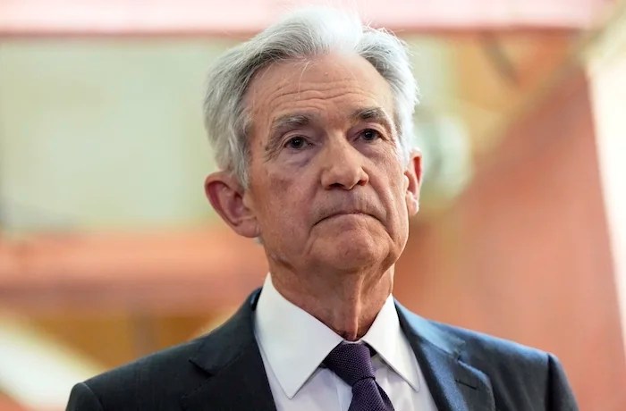 FILE - Federal Reserve Chairman Jerome Powell listens as President Donald Trump visits the Federal Reserve, Thursday, July 24, 2025, in Washington