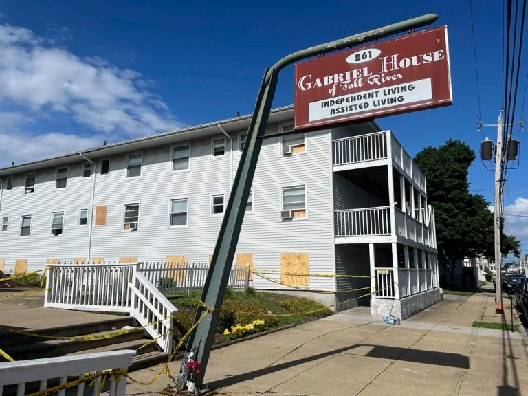 Boards cover the windows of the Gabriel House assisted living facility, where a fire on Sunday killed several people, Tuesday, July 15, 2025 in Fall River, Massachusetts.