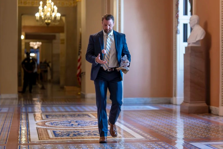 Sen. Markwayne Mullin, R-Okla., bounces a ball off the marble floor near the Senate chamber as Republicans make their final push to advance President Donald Trump's tax breaks and spending cuts package, at the Capitol in Washington, Monday, June 30, 2025.