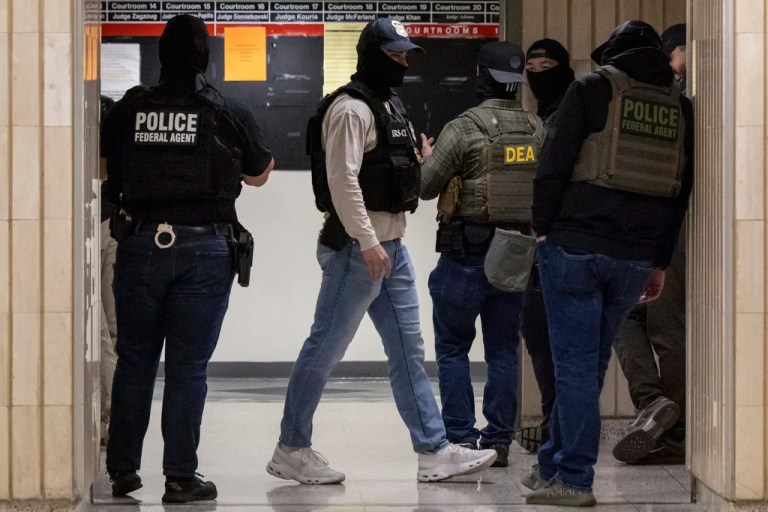 Federal agents walk around at the immigration court at Jacob K. Javits Federal Building in New York, Monday, June 9, 2025. (AP Photo/Yuki Iwamura)