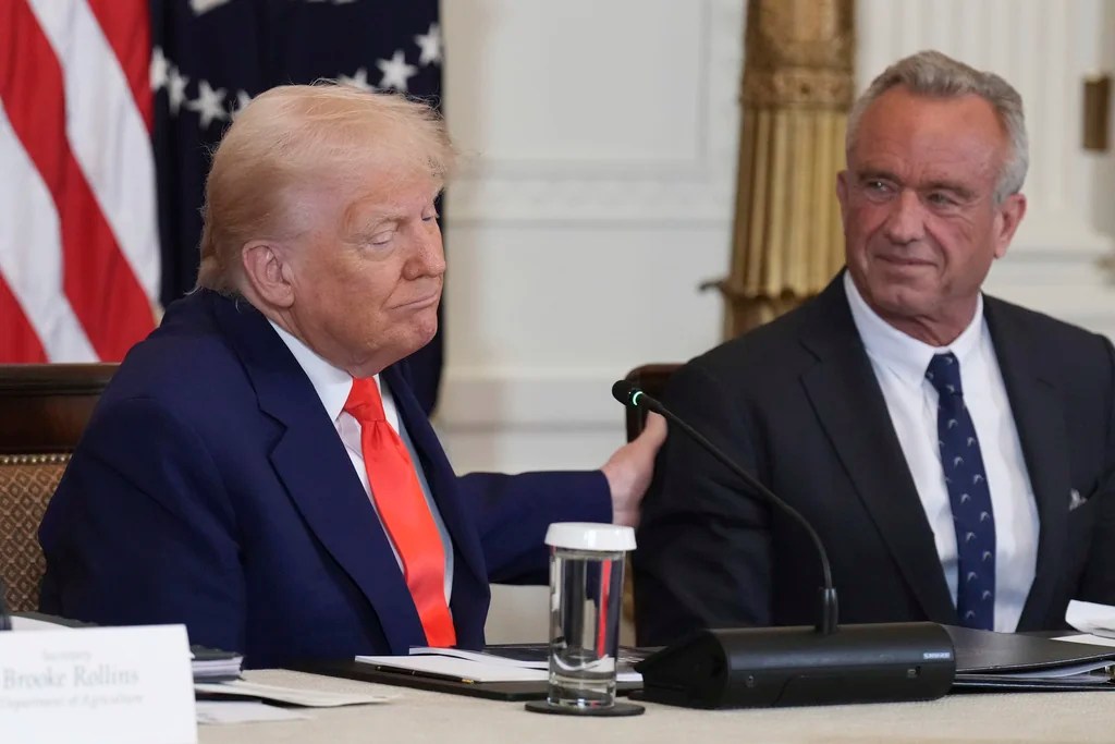 President Donald Trump, left, and Health and Human Services Secretary Robert F. Kennedy Jr. attend a Make America Healthy Again (MAHA) Commission Event in the East Room of the White House, Thursday, May 22, 2025, in Washington.