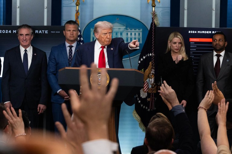 President Donald Trump speaks in the White House press briefing room on Aug. 11, 2025 about the federal takeover of Washington DC police. Defense Secretary Pete Hegseth and Attorney General Pam Bondi are beside him. (Graeme Jennings/Washington Examiner)