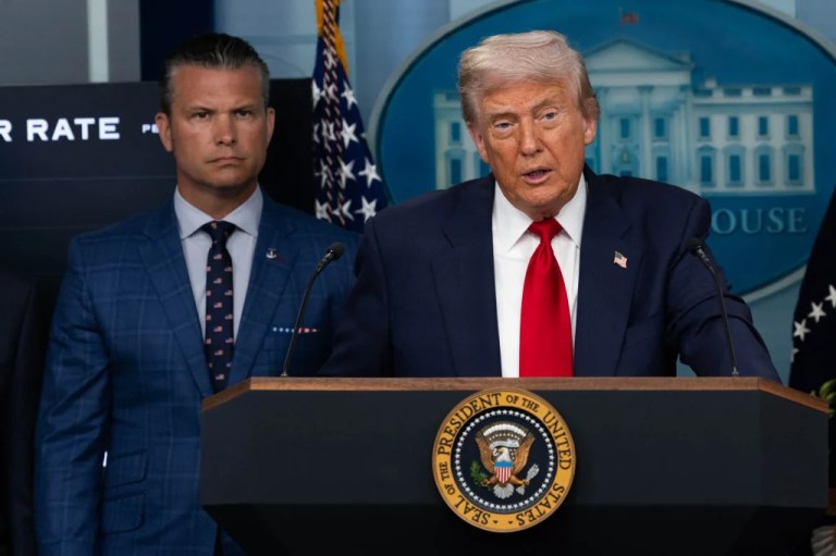 President Donald Trump speaks in the White House press briefing room on Aug. 11, 2025 about the federal takeover of Washington DC police. Defense Secretary Pete Hegseth is beside him. (Graeme Jennings/Washington Examiner)