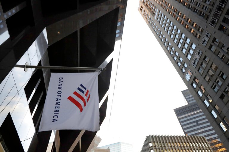 In this Oct. 14, 2019, file photo photo a Bank of America flag waves in front of the Bank of America Financial Center building, in Boston.