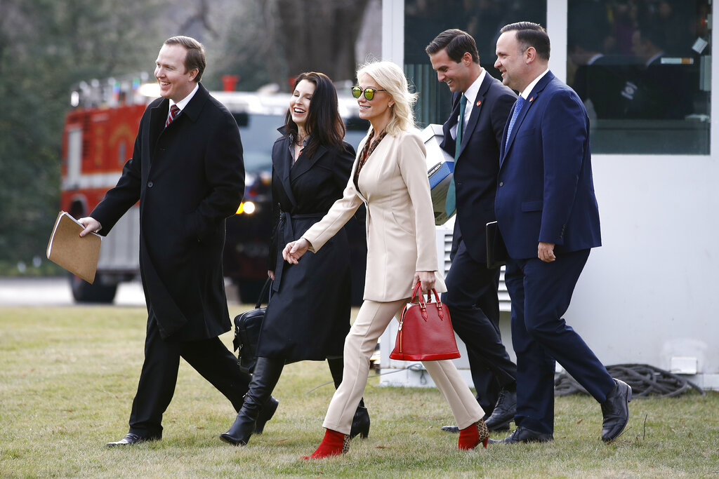 White House Political Director Brian Jack, from left, Deputy Staff Secretery Catherine Keller, Counselor to the President Kellyanne Conway, aide John McEntee and White House Social Media Director Dan Scavino walk across the South Lawn of the White House in Washington, Thursday, Jan. 23, 2020, before boarding Marine One for a short trip to Andrews Air Force Base, Md., and then on to Doral, Fla., for the Republican National Committee's winter meeting. (AP Photo/Patrick Semansky)