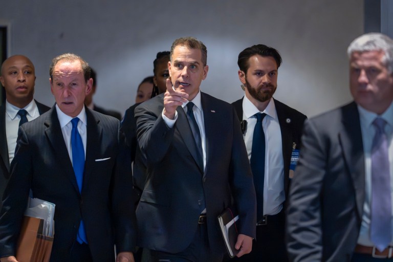 FILE - Hunter Biden, son of President Joe Biden, with attorney Abbe Lowell, left, leaves after a closed-door deposition on Capitol Hill in Washington, Wednesday, Feb. 28, 2024. Biden's lawyers will press a judge Wednesday, May 22, 2024, to delay his trial in Los Angeles, set to begin next month on charges accusing him of a scheme to avoid paying $1.4 million in taxes. (AP Photo/J. Scott Applewhite,File)