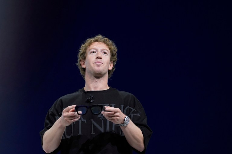 Mark Zuckerberg holds a pair of Orion AR glasses during the Meta Connect conferenceSept. 25, 2024, in Menlo Park, Calif.