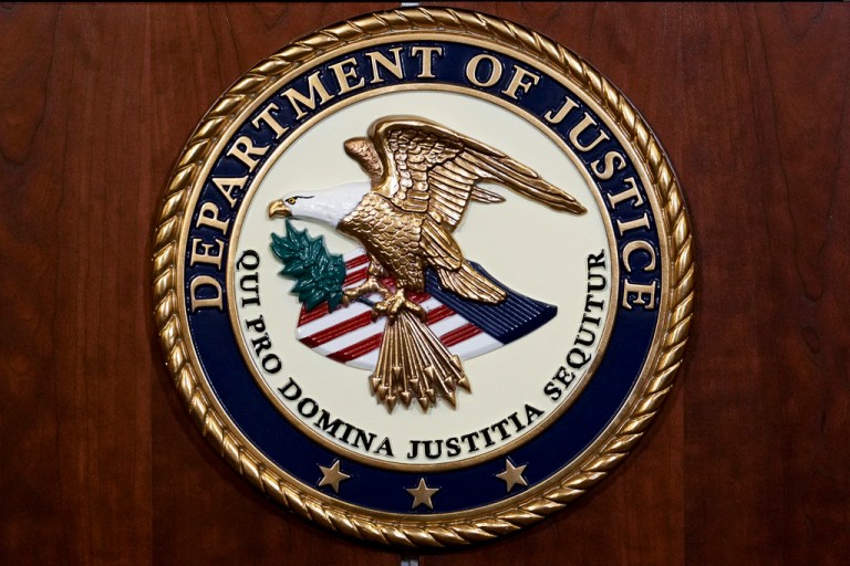 The seal of the Department of Justice.