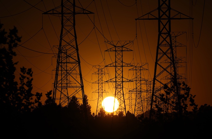 FILE - The sun sets behind high tension power lines on Sept. 23, 2024, in the Porter Ranch section of Los Angeles. (AP Photo/Mark J. Terrill, File)