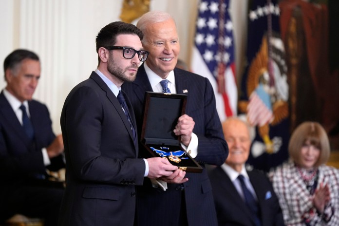 President Joe Biden, right, presents the Presidential Medal of Freedom, the Nation's highest civilian honor, to Alex Soros on behalf of his father George Soros, in the East Room of the White House, Saturday, Jan. 4, 2025, in Washington.